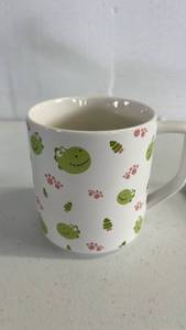 lot 17148 image: Frog Pattern Ceramic Mug with Paw Print Spoon - Retail $15