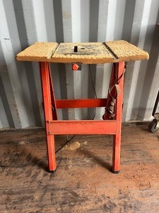 lot 1055N image: Orange Saw Table stand