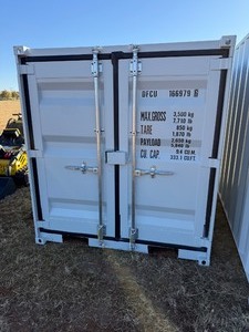 lot 1029N image: Unused 2025 10 Foot Long Shipping container with 2 end doors, side window, side entry door.  Weighs 1750 pounds.