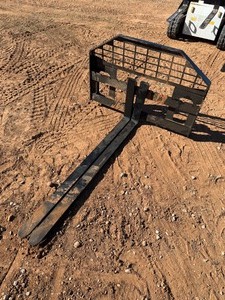 lot 1138N image: Unused Full Size Skid Steer Forks with Carriage and universal quick attach plate  60 inch manual forks