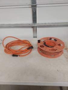 lot 1304 image: Orange Extension Cord and Cord with Storage Reel