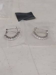 lot 1402 image: BELLA LUCE 1.62CTW Rhodium Plated Sterling Silver Huggie earrings