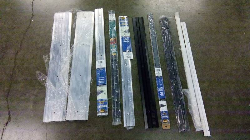 lot 2377 image: lot of door sweeps and threshold seals