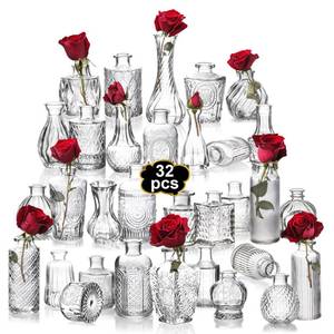 lot 1131 image: Mavora Max Clear Bud Vases Bulk 32,Small Flower Vases for Wedding,Glass Vintage Vase Set for Centerpieces,Recepetion,Home - Retail $36