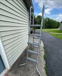 lot 9842 image: Coleman pool ladder with pool covertarp - Retail $0