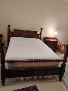 lot 919 image: Queen Sized Bed with Mattress and Box Springs.  Foam topper on top of mattress.  Also comes with Mattress Protector and Bed Skirt.  Headboard 45 x 60.  Footboard 40 x 60