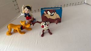 lot 1054 image: Disney Pluto, Taz and Pinocchio figurines
