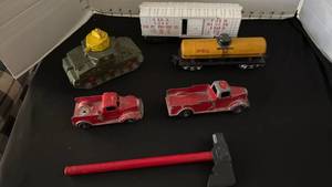 lot 1091 image: Vintage metal train car & trucks, tank, plastic train car and hammer