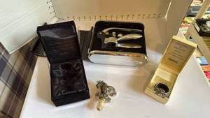 lot 1105 image: Neiman Marcus clown jester bottle stopper and Dove of Peace wine bottle ring with 3 piece wine set in case