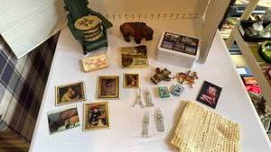 lot 1107 image: Coasters in wood chair, buffalo figurine and magnets