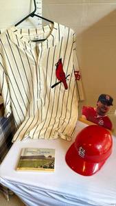 lot 1118 image: St Louis Cardinals button down shirt adult xl, Mark McGwire wood silhouette, helmet and Baseball Stadium postcard album