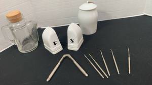 lot 1216 image: Salt and pepper shakers, small canister and glass bottle with spout plus nut cracker and tools