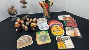 lot 1217 image: Wine corks, stirrers, coasters and glasses