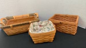 lot 1228 image: Lined Longaberger basket 5x8x8 and other baskets