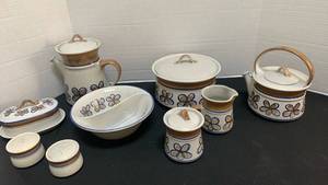 lot 1238 image: Poppy Trail Hand-Painted Blue Floral Ceramic serving pieces, salt and pepper, cream and sugar, coffee and tea pots, butter dish and divided bowl