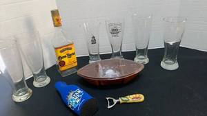 lot 1240 image: Beer glasses with Koozie, football storage container and Bottle Opener