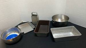 lot 1263 image: Metal mixing bowls, loaf pans, cheese grater and napkin holder