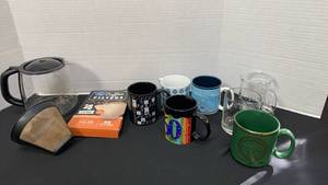 lot 1286 image: Krupa replacement pot, filters, and coffee mugs