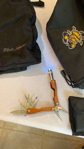 lot 1342 image: Wichita State new duffle bag, Rick Steves backpack and Eddie Bauer multi tool with case