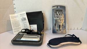 lot 1420 image: Rechargeable Shaver and an unopened Shick Quatro Razor