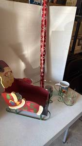 lot 3114 image: Santa Christmas card holder 18in long, holiday mugs and paper