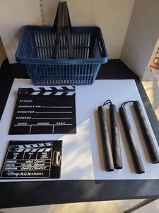 lot 3200 image: Film clapboard, clapboard notebook for 5x7 pad of paper, foam nunchucks, carry basket