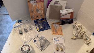 lot 3522 image: Lightbulbs, extension cords, timer and rug gripper