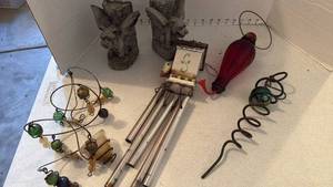 lot 3526 image: Gargoyle bookends, wind chimes, hummingbird feeder