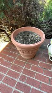 lot 4001 image: Large Plastic Terracotta Garden Planter with Floral Relief 18 inches tall, 19 12 inches across