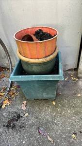 lot 4113 image: Two plastic, one ceramic and one terracotta planters