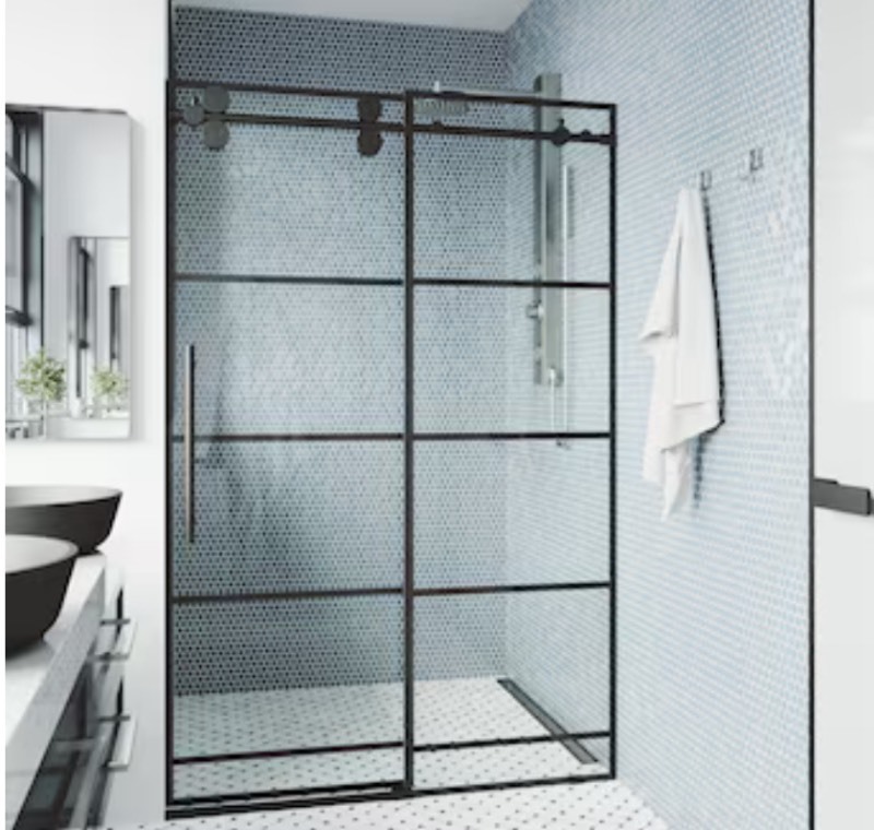 lot 44 image: VIGO Elan Matte Black Grid 56-in to 60-in W x 74-in H Frameless Clear Glass Sliding Shower door Retails $1,249