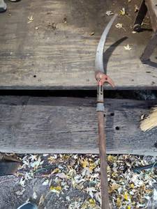 lot 143 image: Large Two-Person Crosscut Saw with Orange Handle