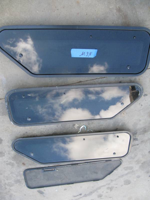lot 979 image: 1 NEW and 2 used Kenworth Areodyne windows