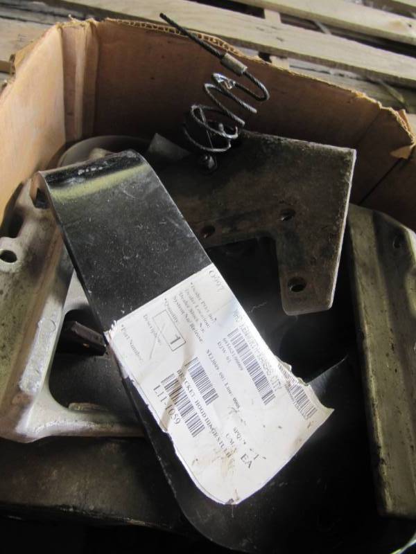 lot 1003 image: Box of Kenworth hood hinge parts