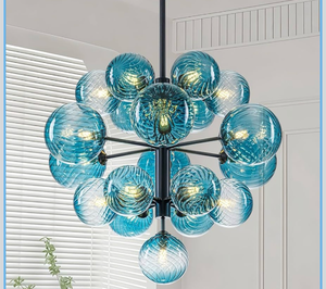 lot 579 image: Blue Glass Bubble Chandelier Light Fixture, 19-Light Tier Bubble Black Mid Century Modern Sputnik Dining Room Chandelier over Table, 24 Hand Blown Glass Swirled Ball Chandeliers Globe Pendant Light - Retail $400