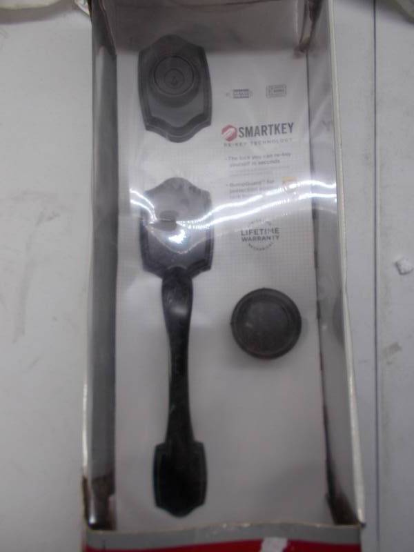 lot 1231 image: deadbolt and doorknob set