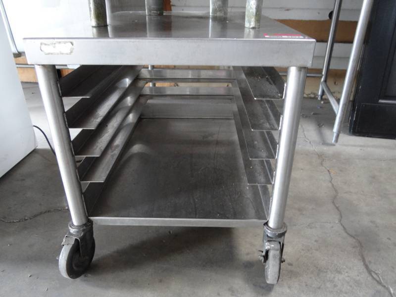 lot 5203 image: Stainless Equipment Stand on Cast with 4 Openings