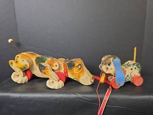 lot 357 image: Fisher Price Snoopy and  Playfull Puppy Pull Toys - work as they should