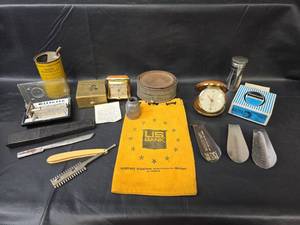 lot 701 image: Seth Thomas and Westclox Travel Clocks, Shoehorns, Gasoline Measuring Can, US Bank Bag, and More