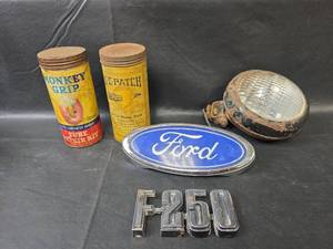 lot 709 image: Ford F-250 Parts Emblems with Monkey Grip Repair Kit and More
