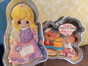 lot 127 image: Cake Pans - Precious Moments 93 and Popeye 80