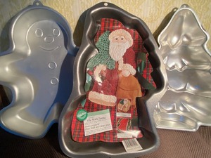 lot 131 image: Cake Pans - Holiday Gingerbread Man 85, Santa 99 and Tree 86