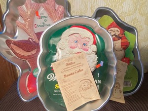 lot 132 image: Cake Pans - Holiday Reindeer 88, Santa 79 and Snowman 80