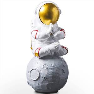 lot 9367 image: Astronaut Figurine Statue, Meditation Astronaut Figure Sculpture for Desktop and Tabletop, Resin Spaceman Planet Desk Ornament for Outer Space Themed Bedroom Decor, Cake Toppers Model Gift