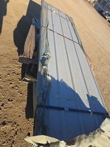 lot 12014 image: Unused Qty. 100 Galvalume Steel Siding  Roofing Panels  White  Cream  9 ft 10 in. long x 38 inches wide