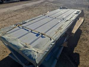 lot 12016 image: Unused Qty. 100 Galvalume Steel Siding  Roofing Panels  White  Cream  9 ft 10 in. long x 38 inches wide