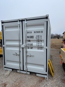 lot 1192D image: Unused 2025 12 Foot Long Shipping container with 2 end doors, side window, side entry door.  Weighs 2100 pounds.