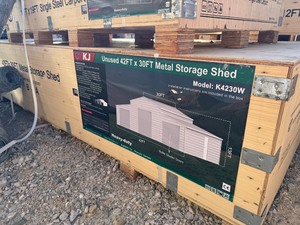 lot 1205D image: Unused K4230W 42 x 30 Triple Garage Metal Building  Cream in color, 26 gauge sheet metal, 3 Roll up doors and Includes 1 walk through door. 13 ft height
