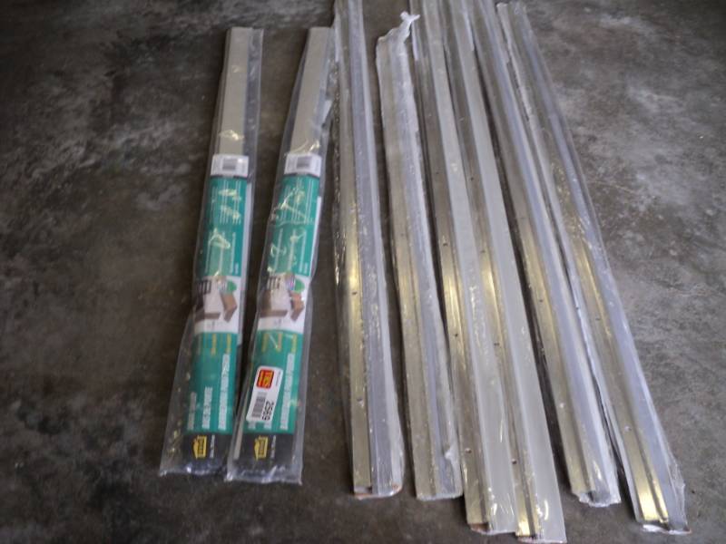 lot 2569 image: (8) CT mixed lot door sweeps,  door bottoms