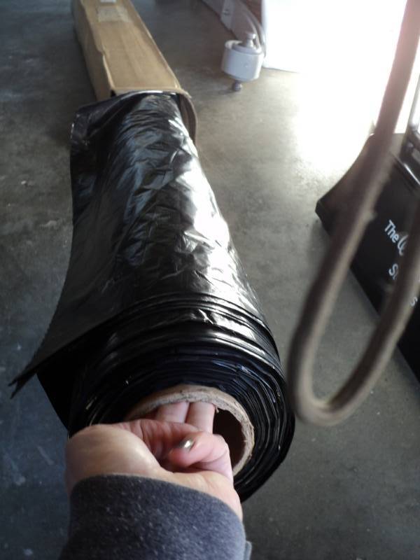 lot 2592 image: (1) roll black plastic drop cloth